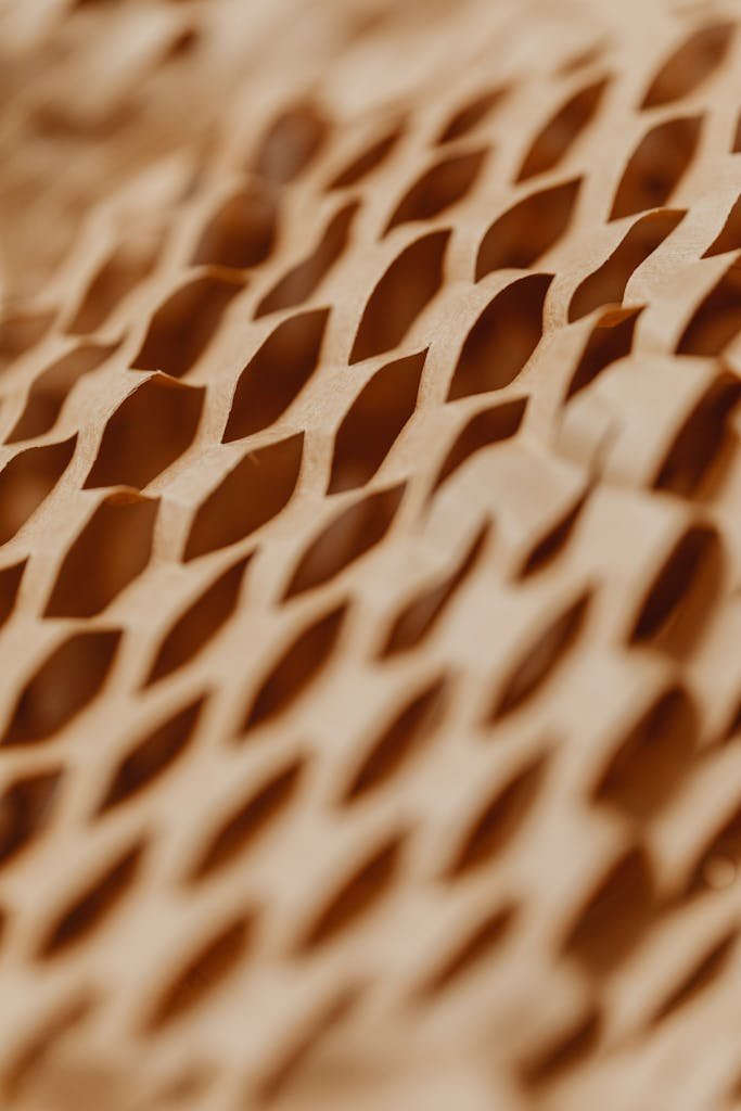 Detailed view of a honeycomb textured cardboard pattern showcasing intricate design and texture.
